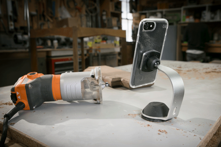 Graphic image of MagicMount Pro phone mount on workshop table