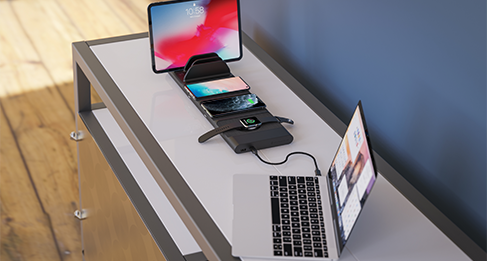 devices chargina via modular charging station on table