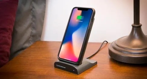 phone charging on nightstand