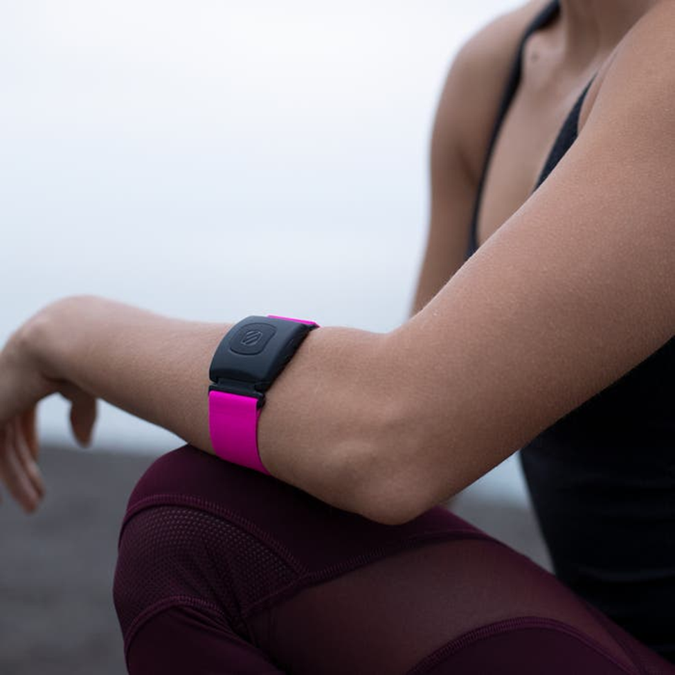 woman wearing scosche rhythm plus 2 0 heart rate monitor armband